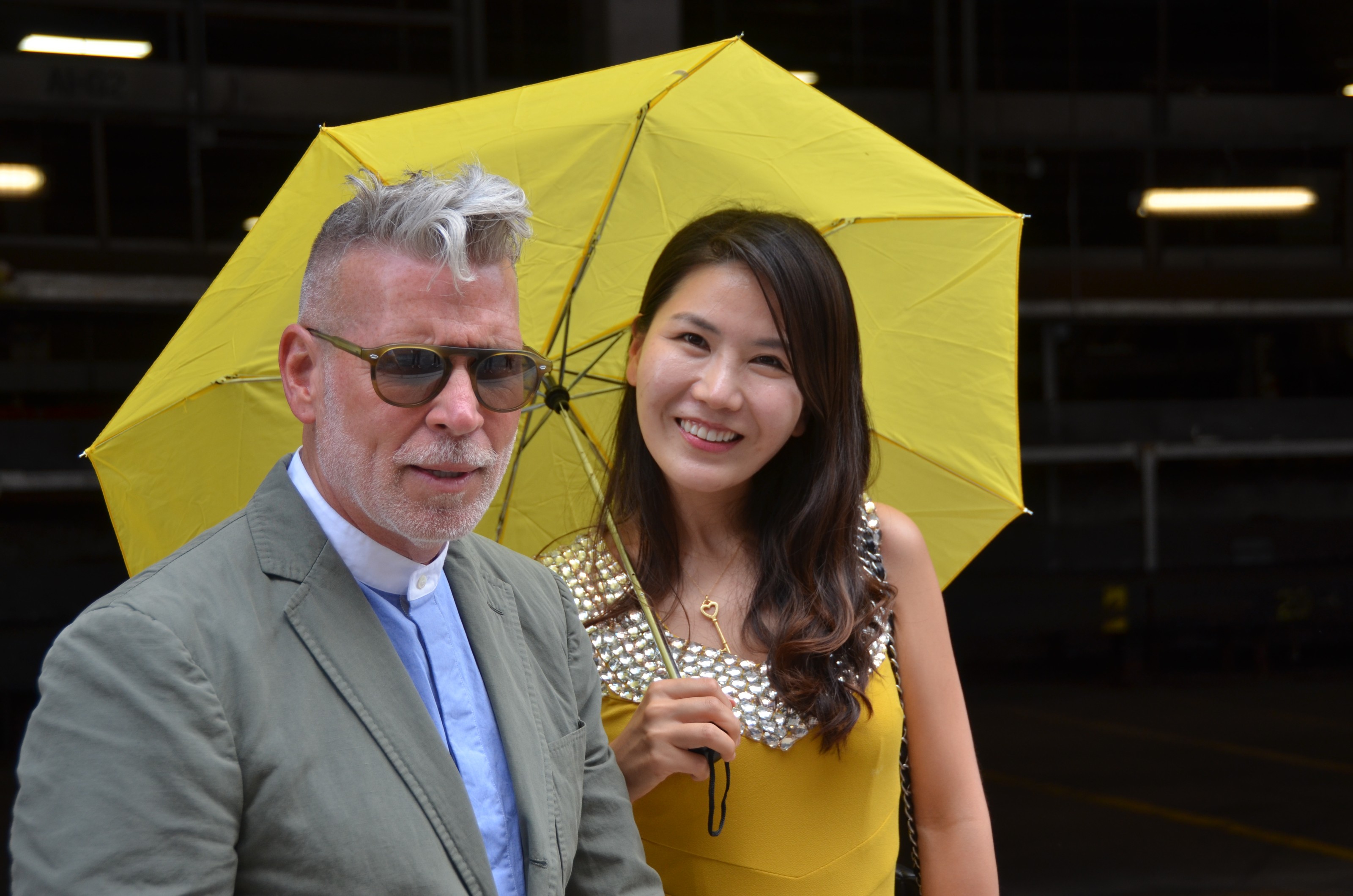 Nick Wooster and girl with yellow umbrella
