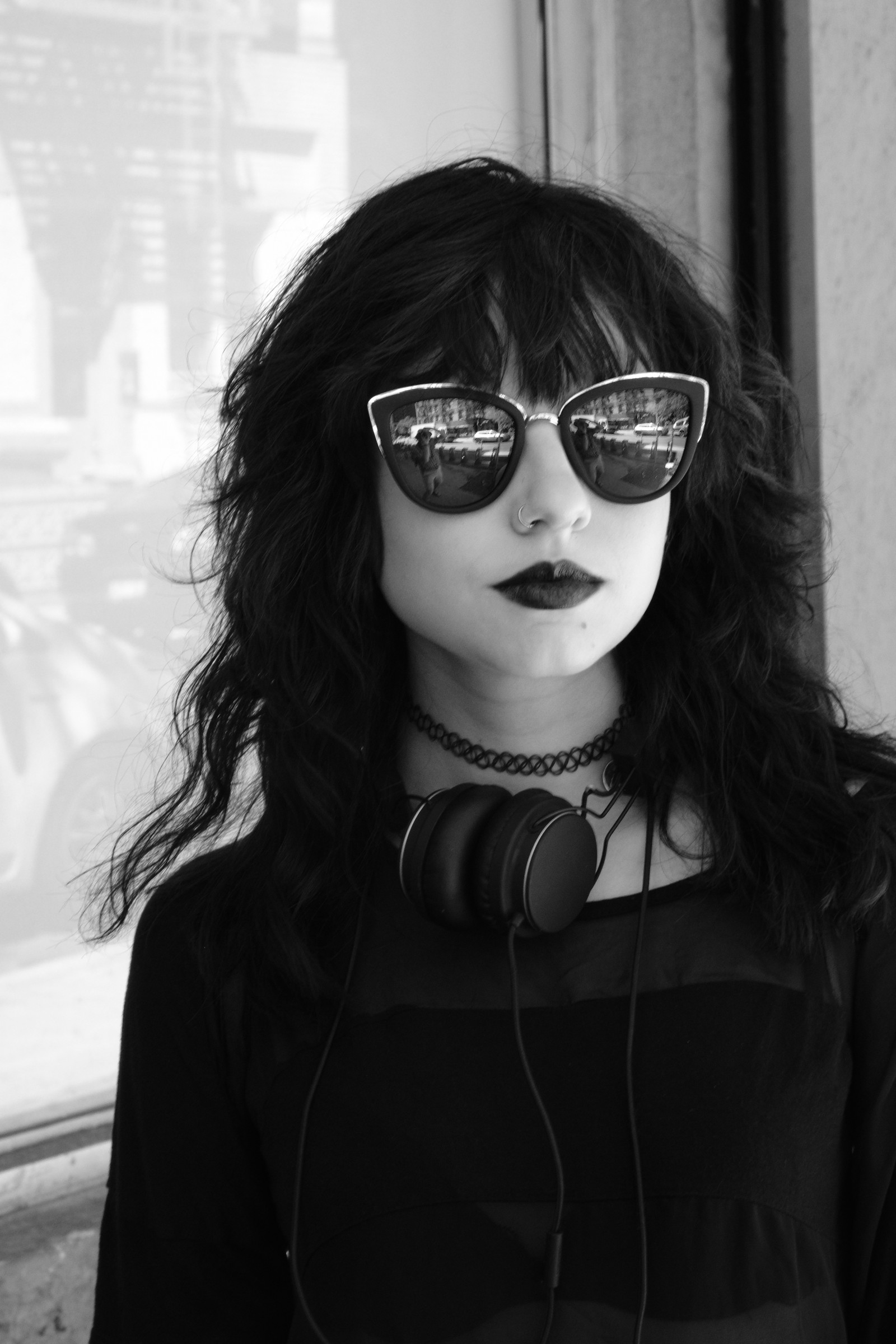 b&w photo of girl in sunglasses