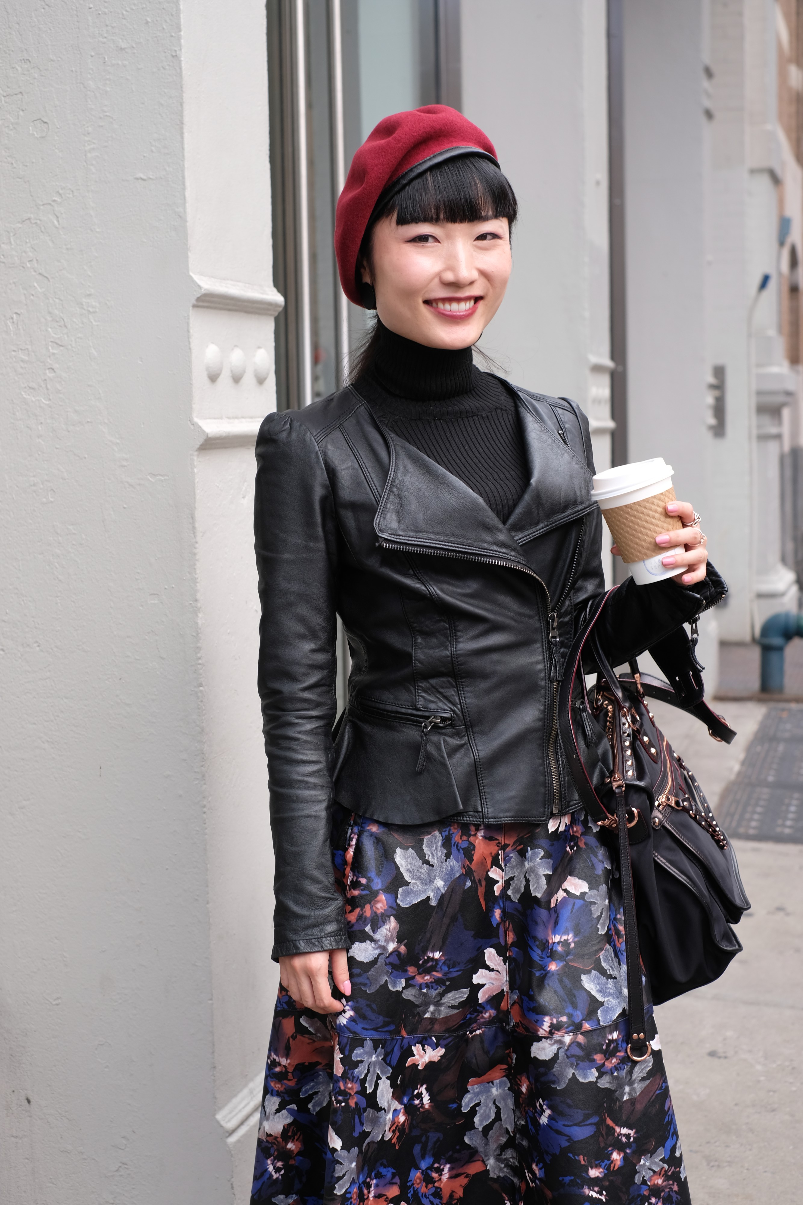 Asian girl in floral dress and black jacket