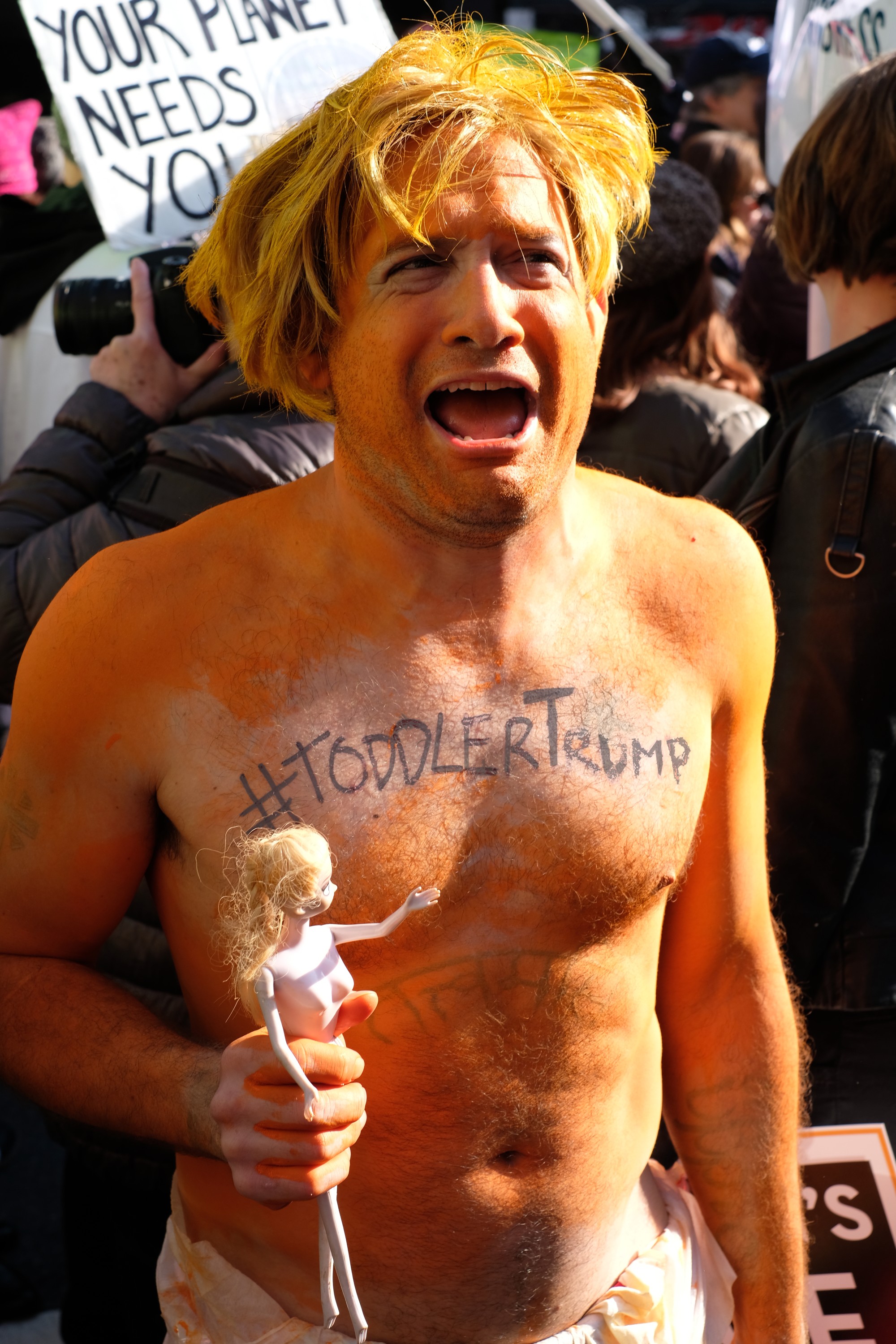 man with orange skin mocking Trump