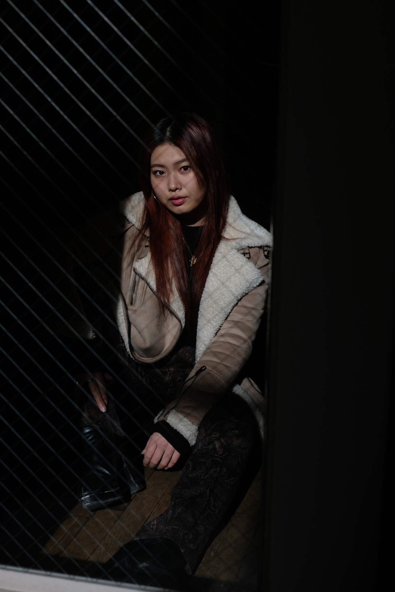 Japanese girl in black outfit and shearling jacket