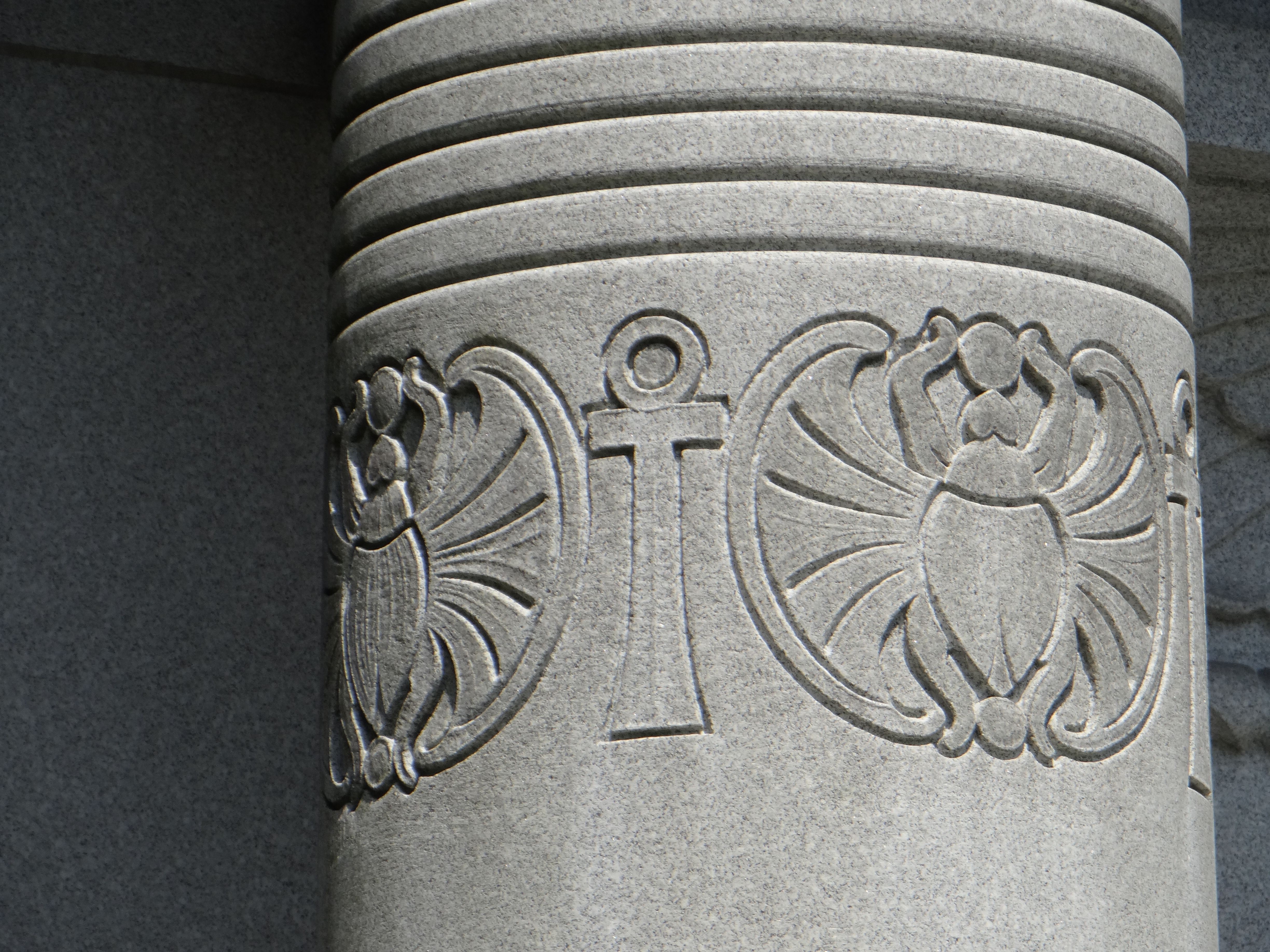 column with ankh cross and scarab