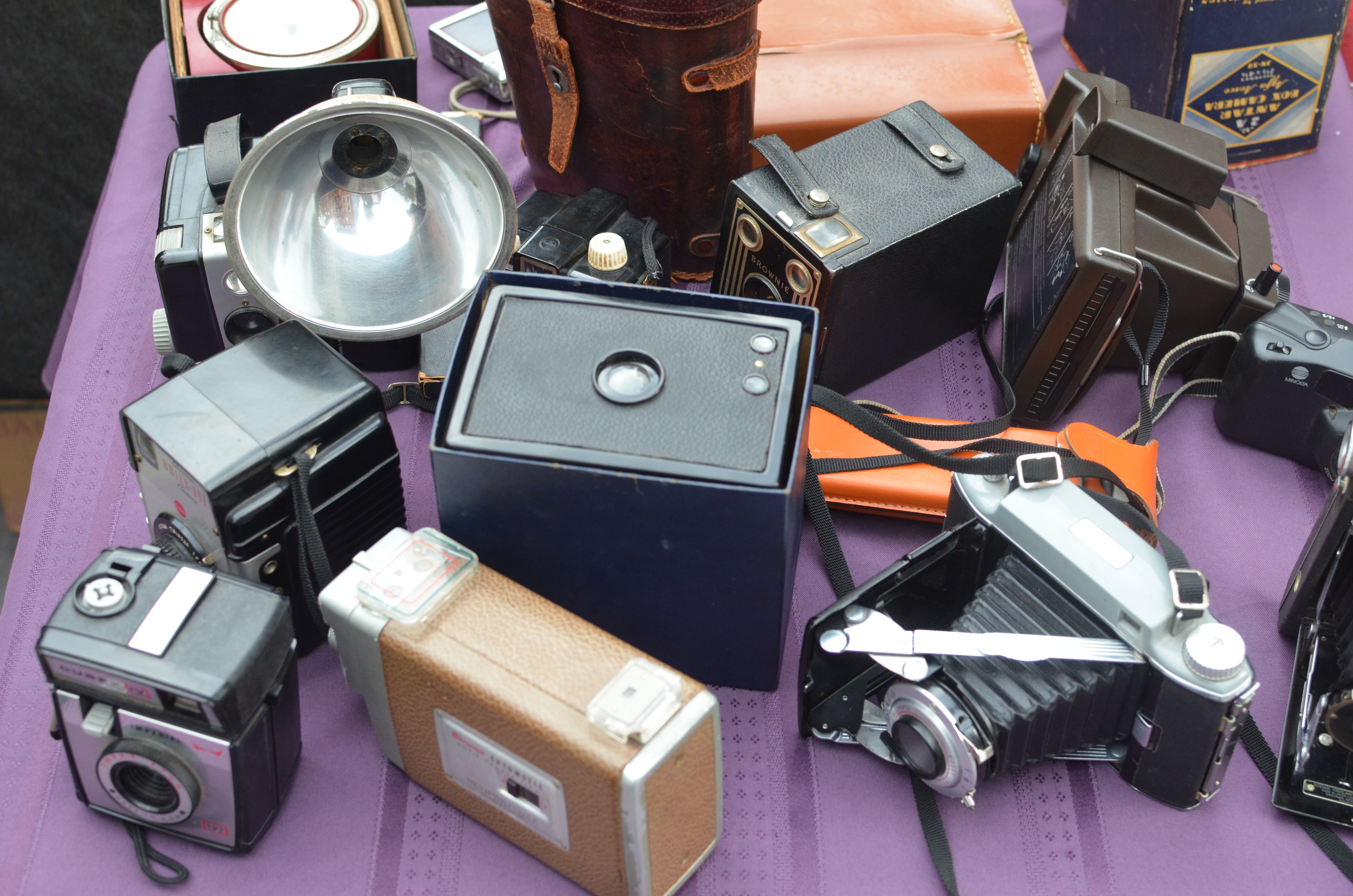 old cameras on a street vendor's table