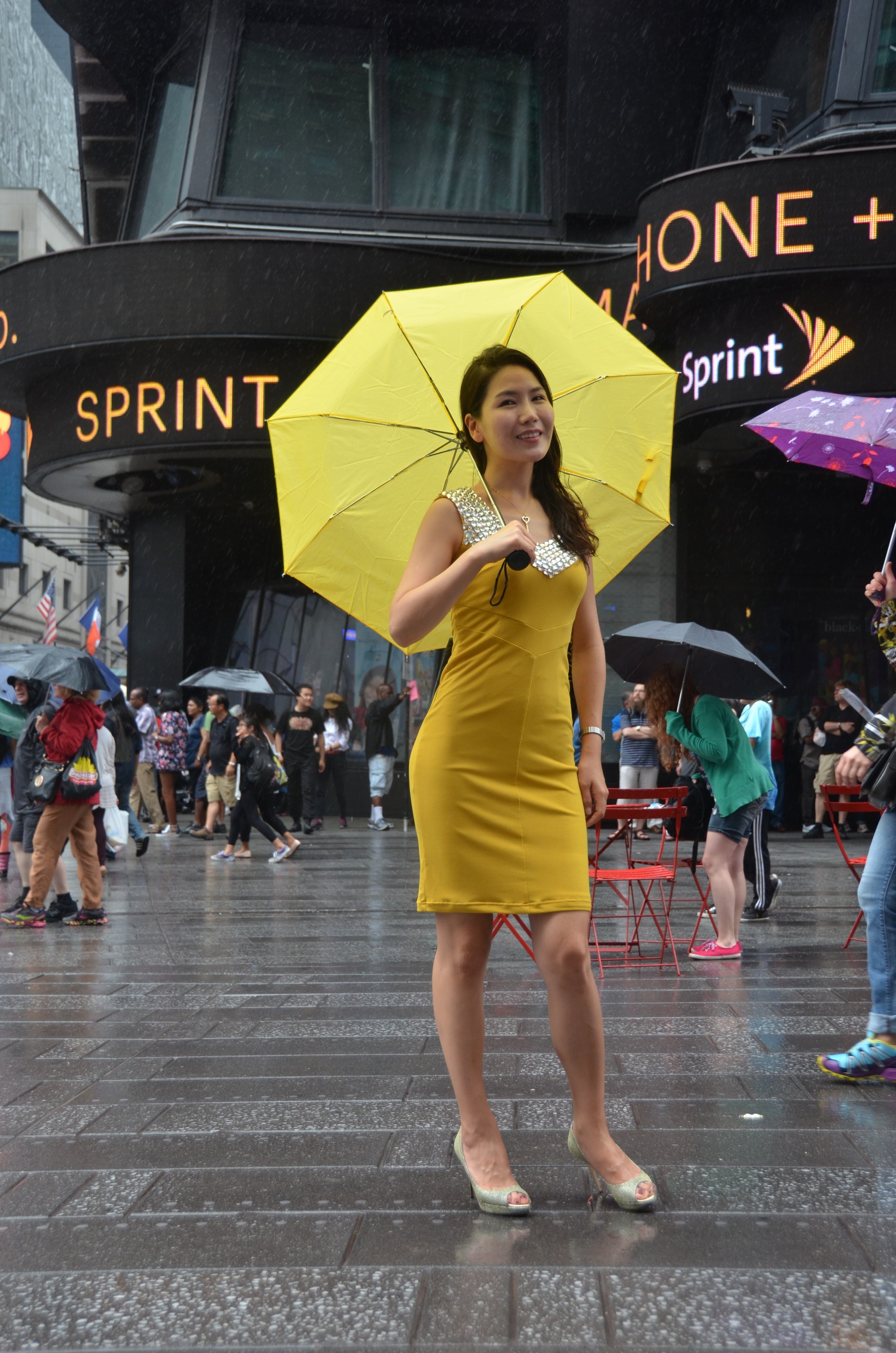 Asian girl in yellow dress in Time Square