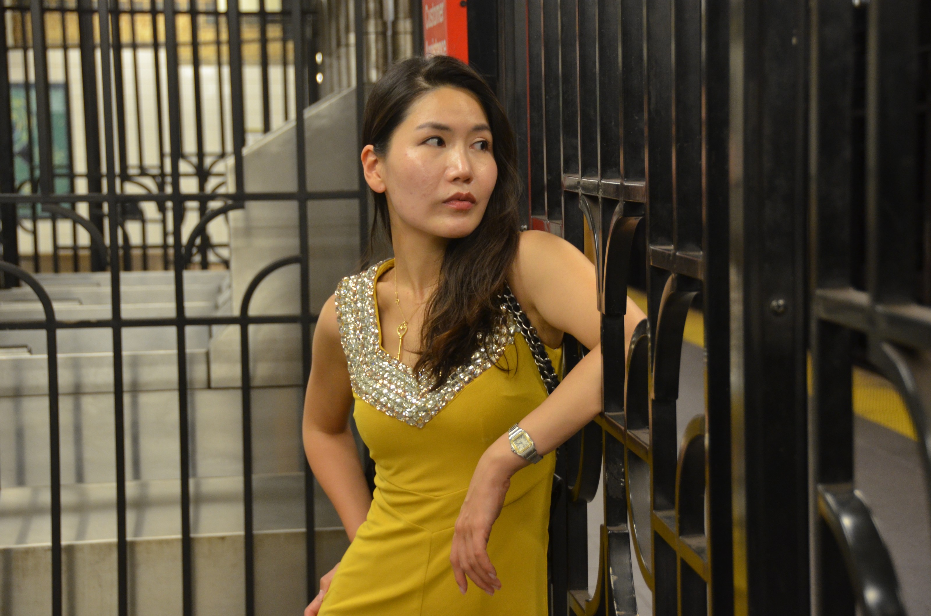 girl in yellow dress in NYC subway
