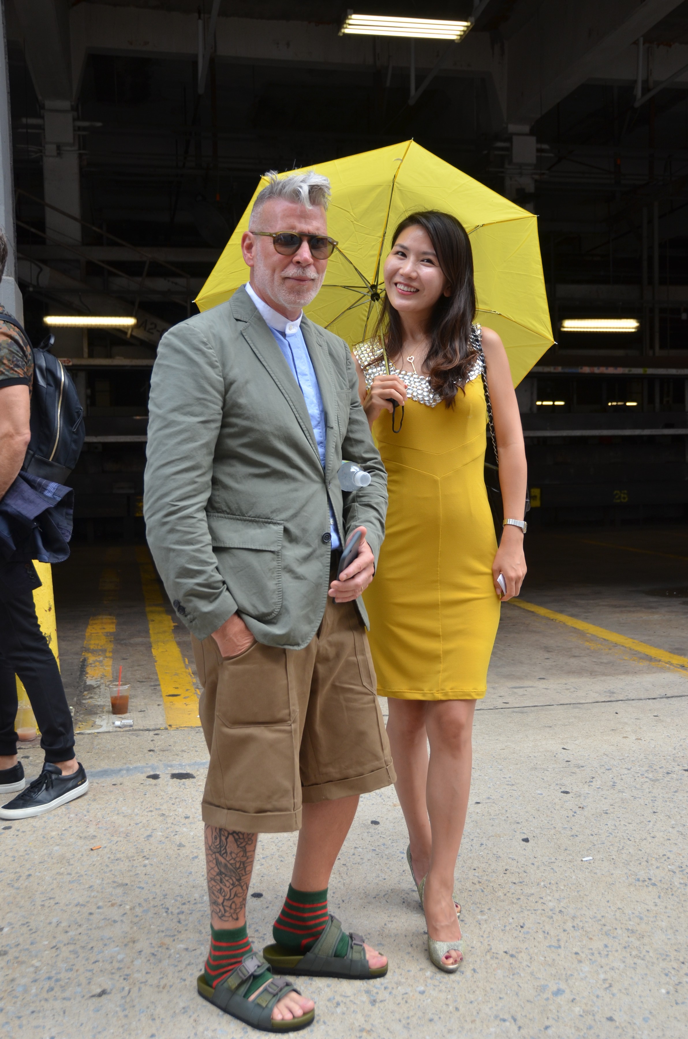 nick wooster and girl with yellow umbrella