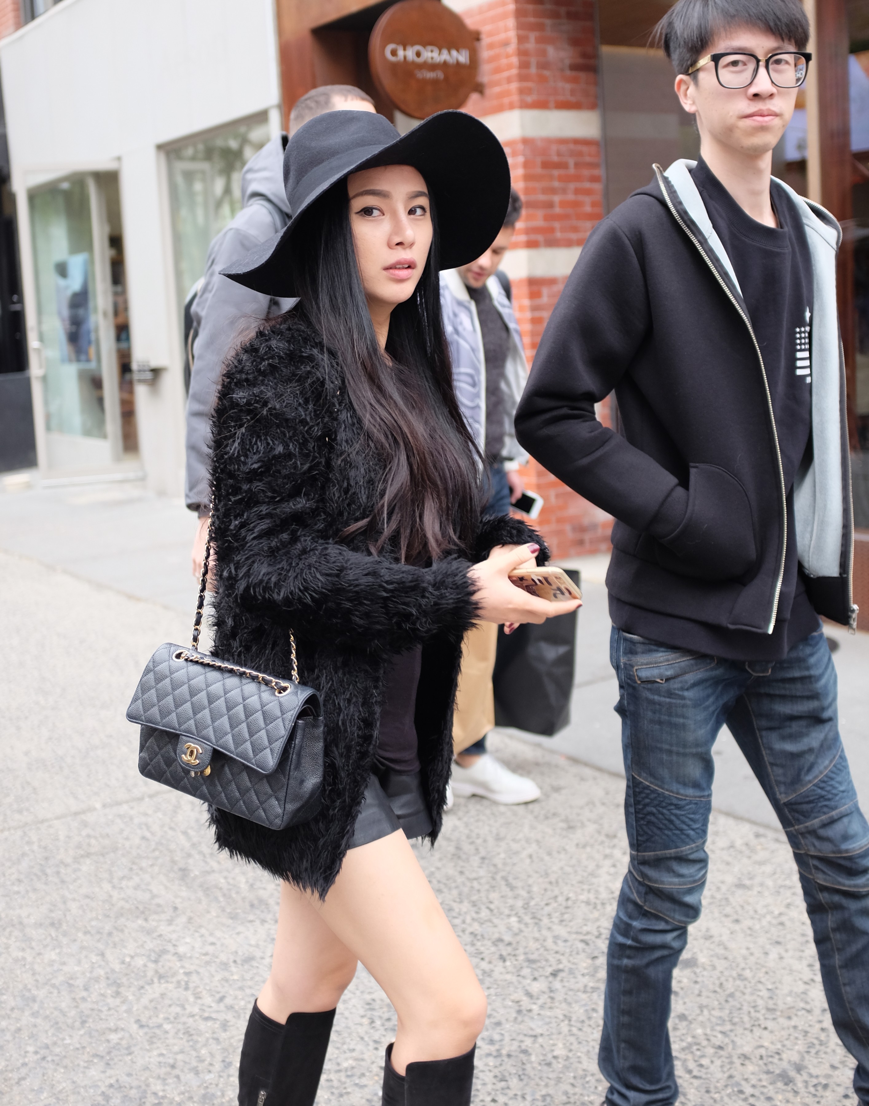 Asian girl wearing black brimmed hat