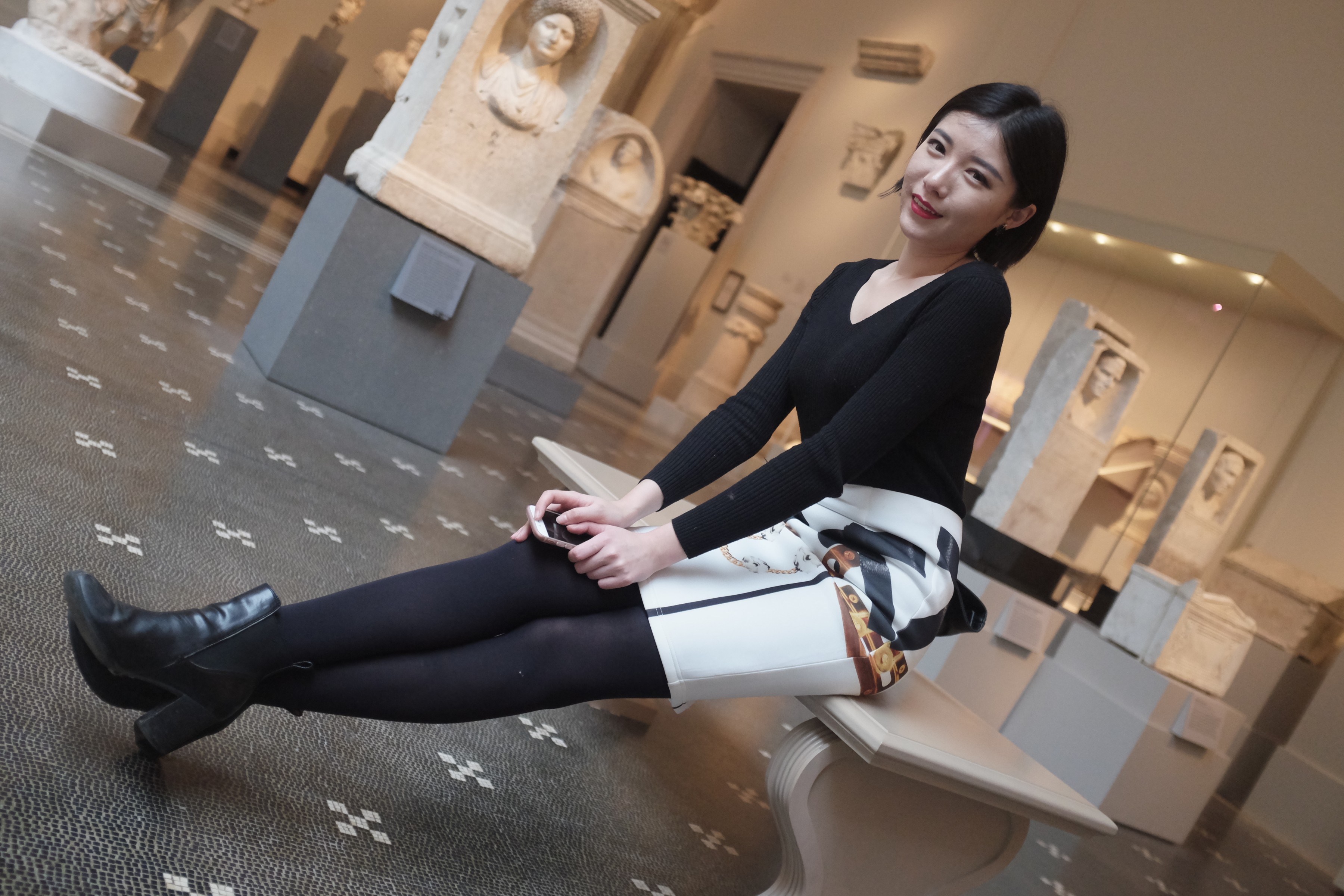 girl in black and white outfit at museum