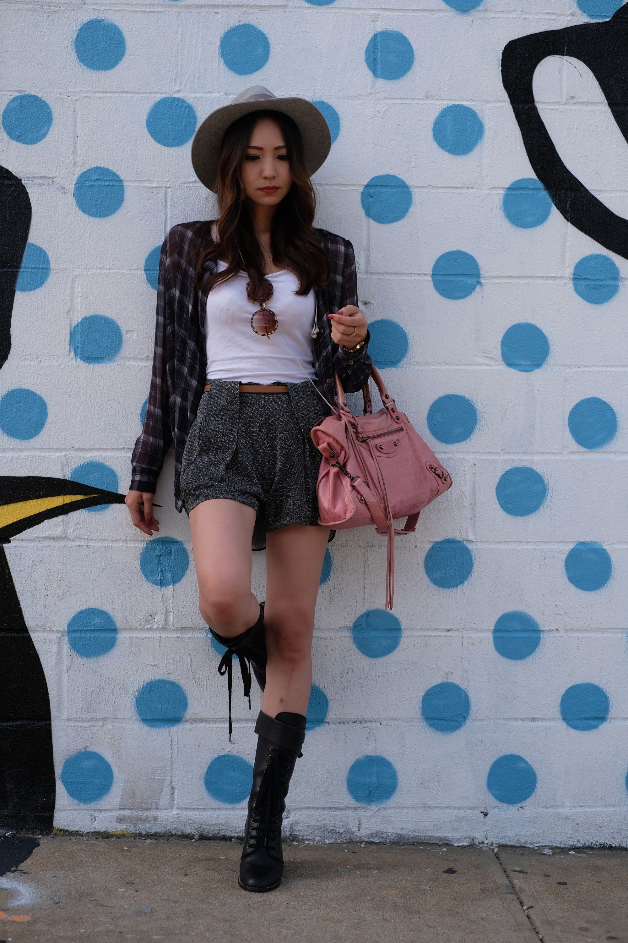 pretty Japanese girl in front of street art