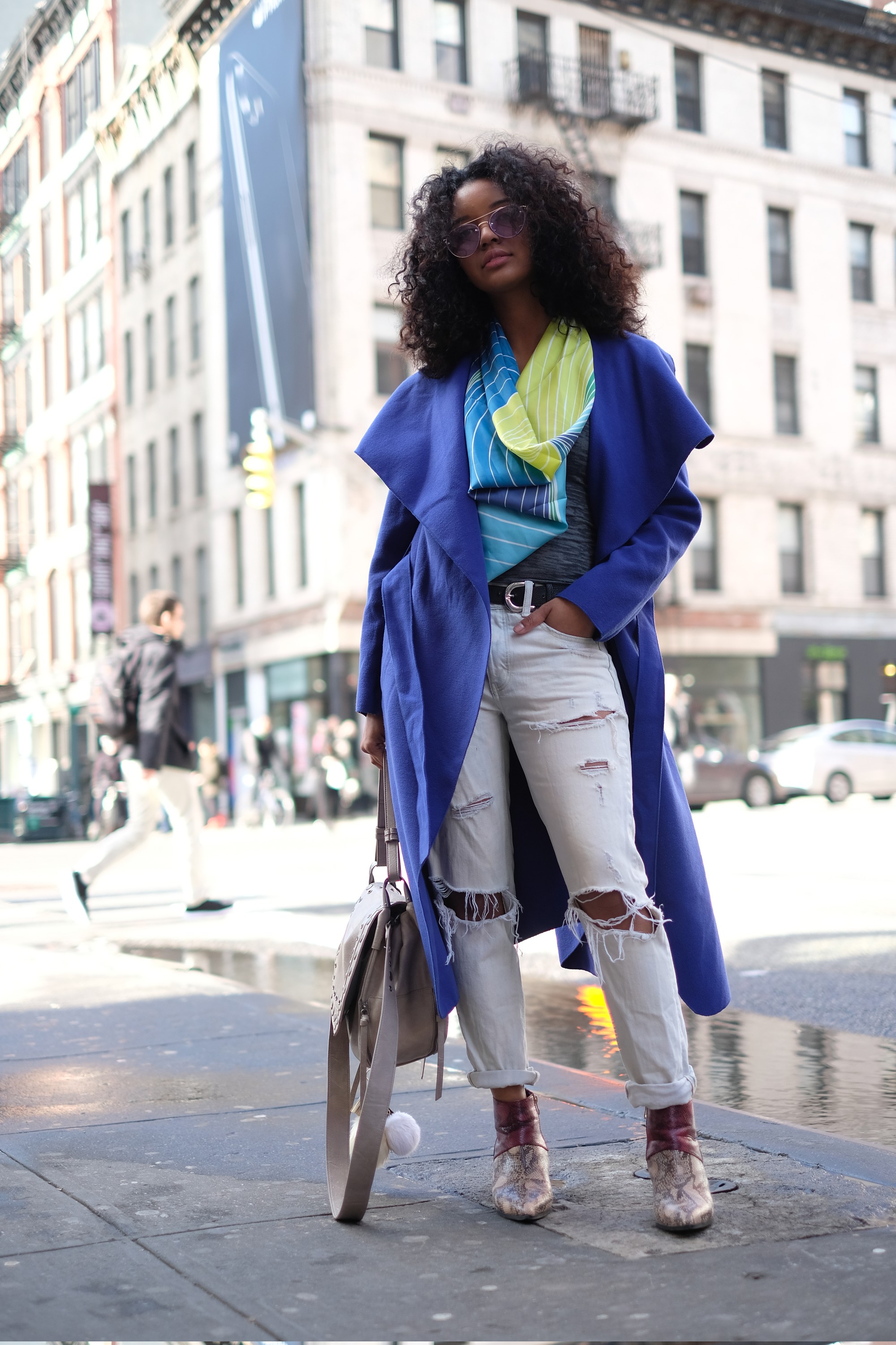 girl in blue coat on the street