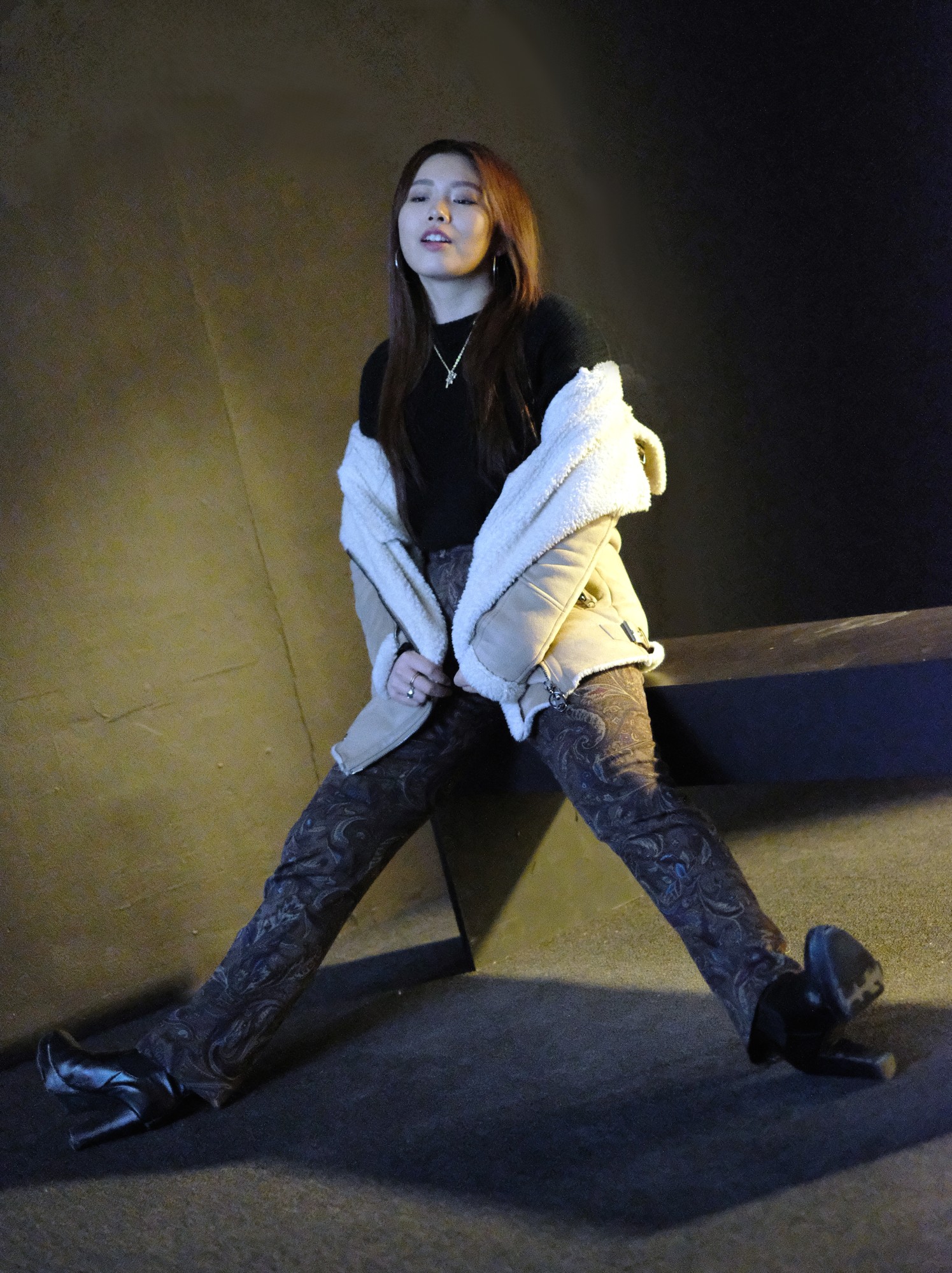 Japanese girl in black outfit and shearling jacket