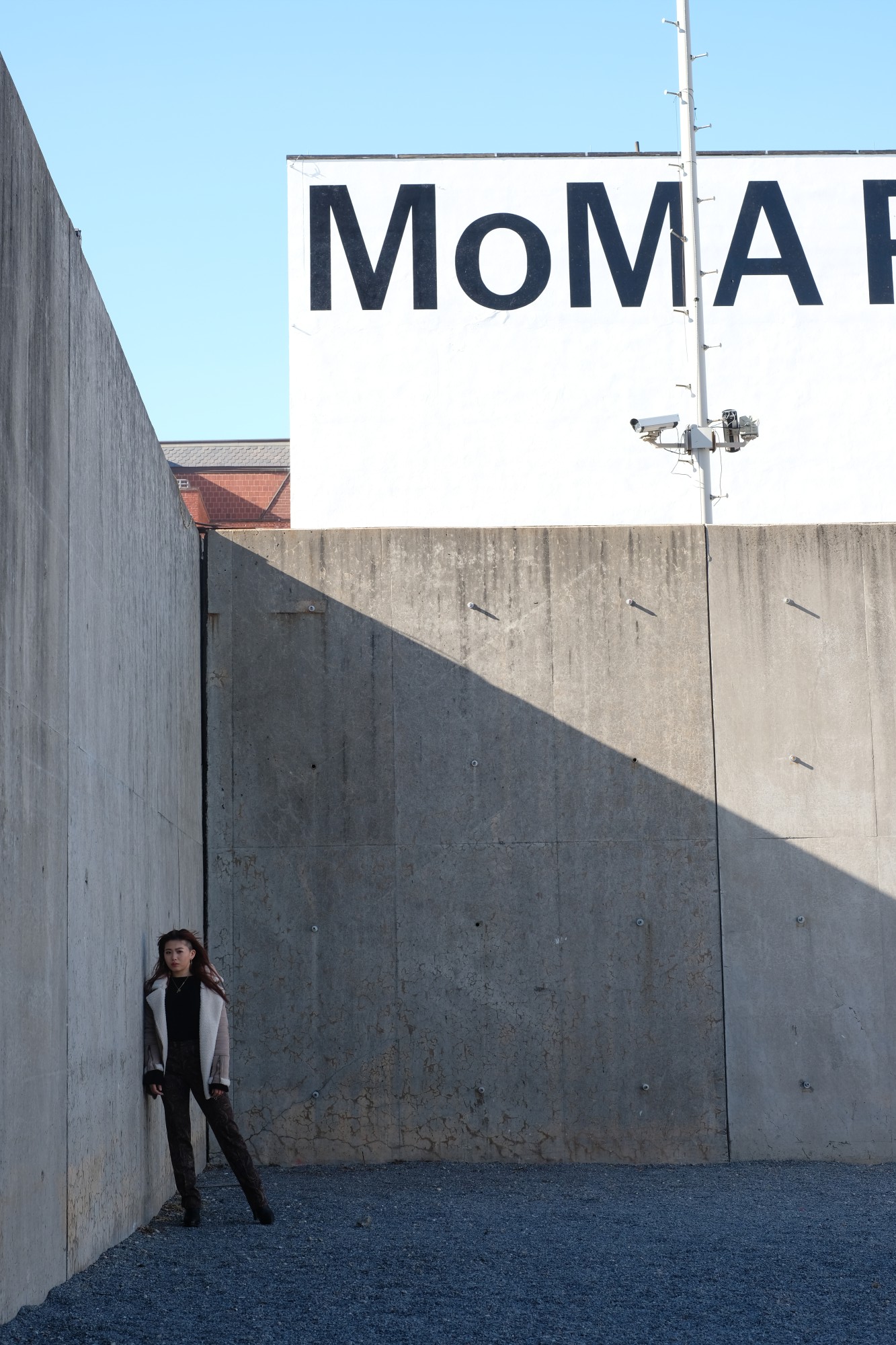 Japanese girl by concrete walls